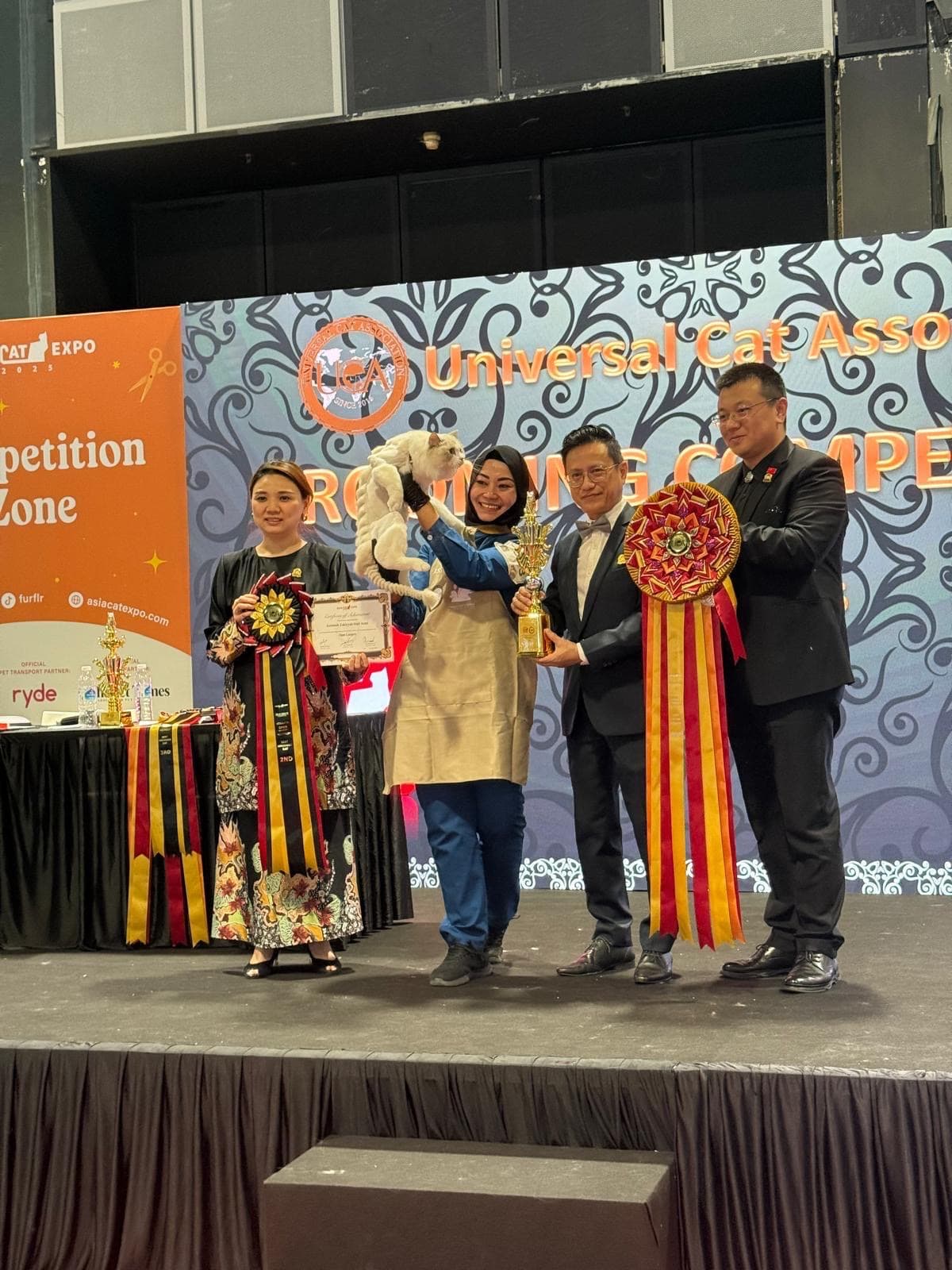 Zee at UCA Competition receiving award